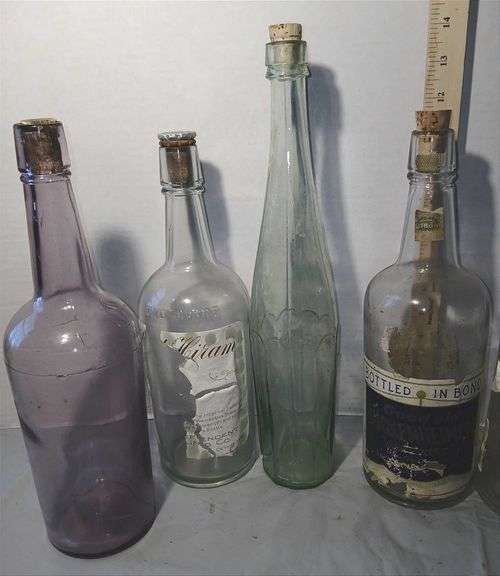 Collection of Clear & Purple Old Liquor Bottles