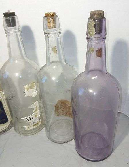 Collection of Clear & Purple Old Liquor Bottles