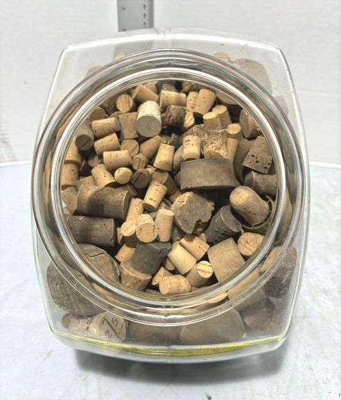 Glass Cookie Jar Containing Various Sizes of Corks