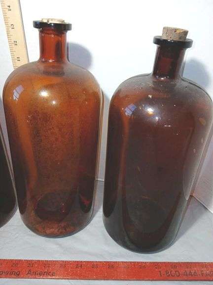 Four 13" Tall Brown Glass Apothecary Bottles