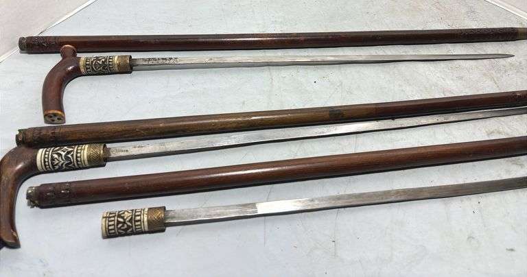 Three Hand Carved Sword Canes