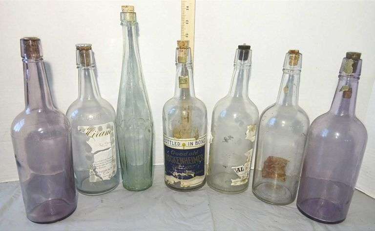 Collection of Clear & Purple Old Liquor Bottles