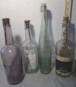Collection of Clear & Purple Old Liquor Bottles