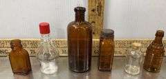 Tote with Lid Filled with Vintage Glass Bottles