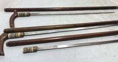 Three Hand Carved Sword Canes