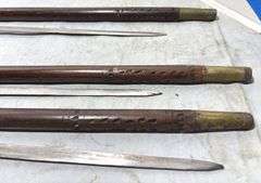 Three Hand Carved Sword Canes