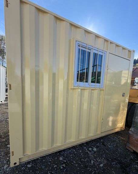 10' Storage Container With 1 Door + 1 Window 10’Lx 7’4”Wx 8’4”H has a hole on one side, see photos ~