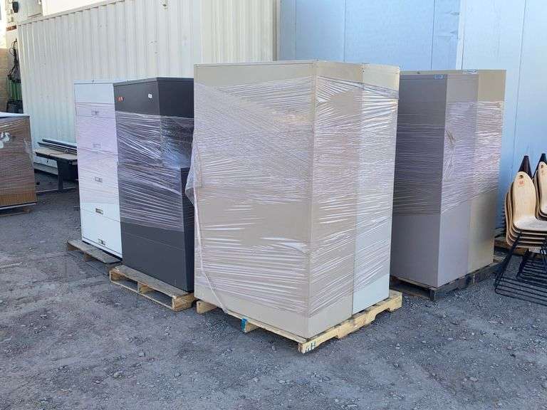 Six pallets with approximately 14 assorted metal filing cabinets ...