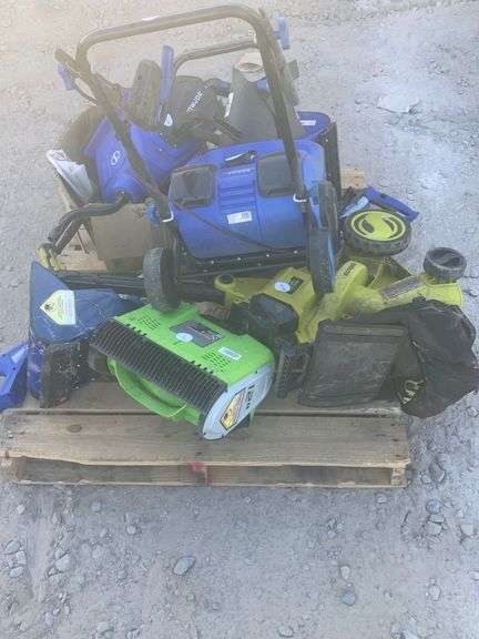 Assorted electric snowblowers and parts.