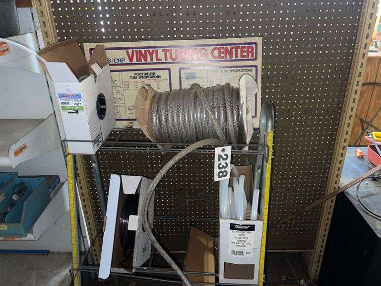 Vinyl Tubing rack with rolls of tube.