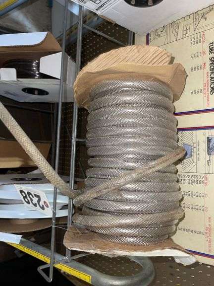 Vinyl Tubing rack with rolls of tube.