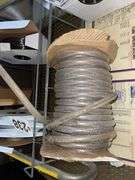 Vinyl Tubing rack with rolls of tube.