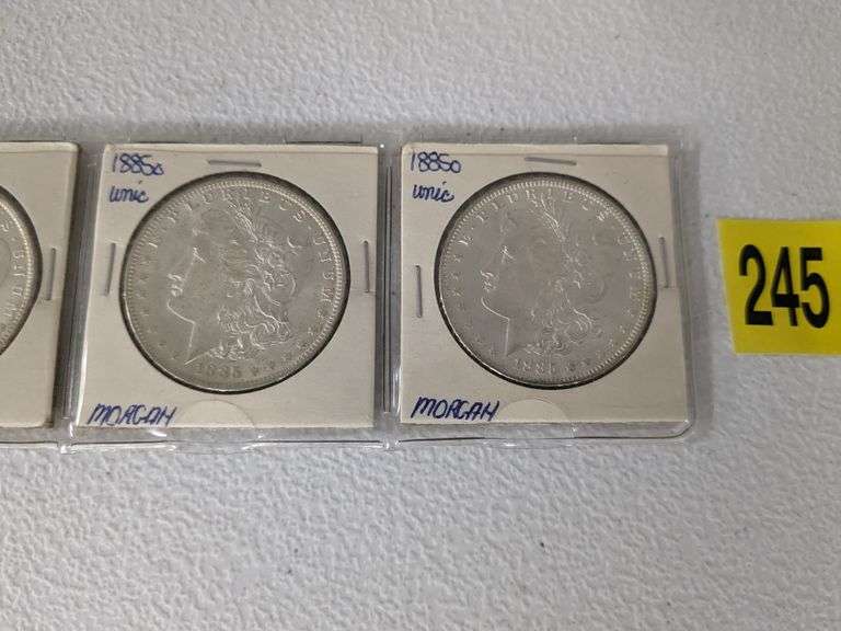 Lot of four 1885 O Morgan Silver Dollars