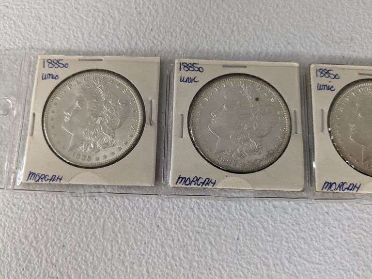 Lot of four 1885 O Morgan Silver Dollars