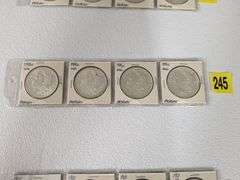 Lot of four 1885 O Morgan Silver Dollars