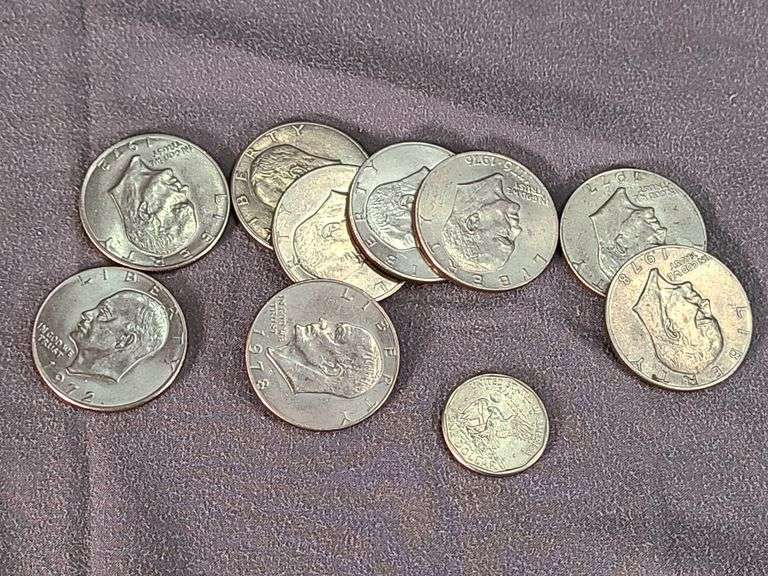 9 Ike dollars & a 1999 Susan B Anthony dollar.