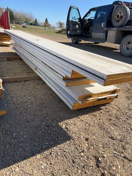 Qty of garage door panels various sizes & lengths (1 stack)