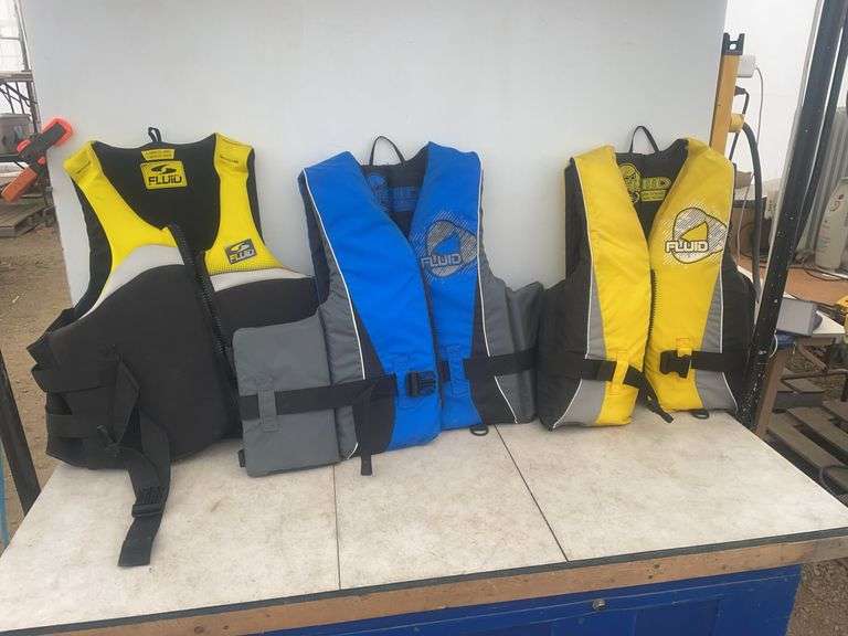 3 Fluid lifejackets one is large, one is extra large, and one is extra extra large