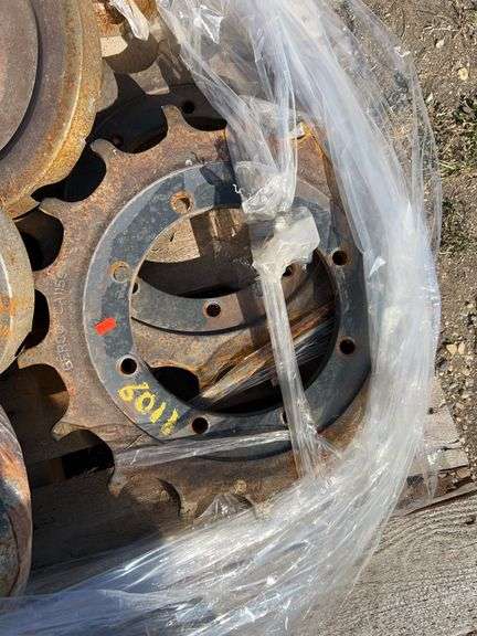Pallet of Case 270 skidsteer bogey wheels & idlers - drive sprockets reversed once