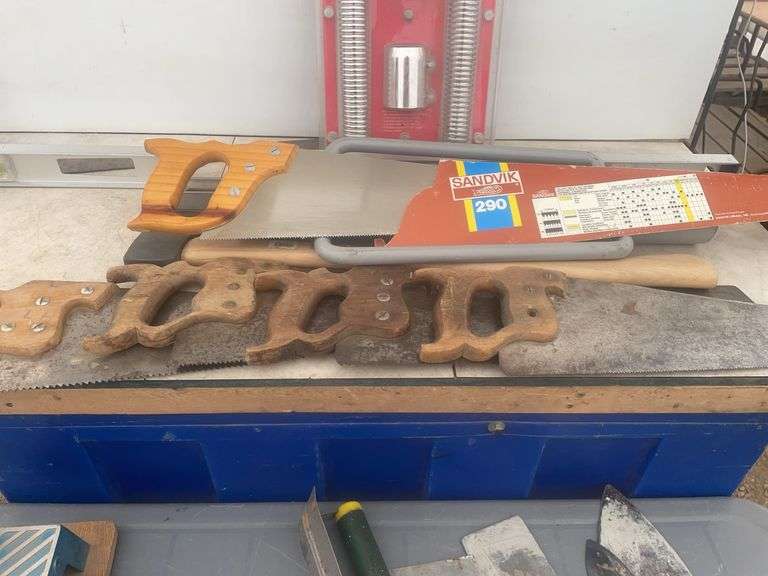 Post pounder, axe, quantity of hand saws, levels, hand mitre saw, trowels etc.