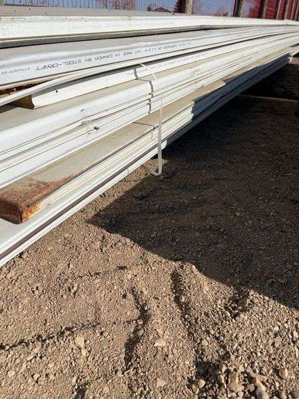 Qty of garage door panels various sizes & lengths (1 stack)