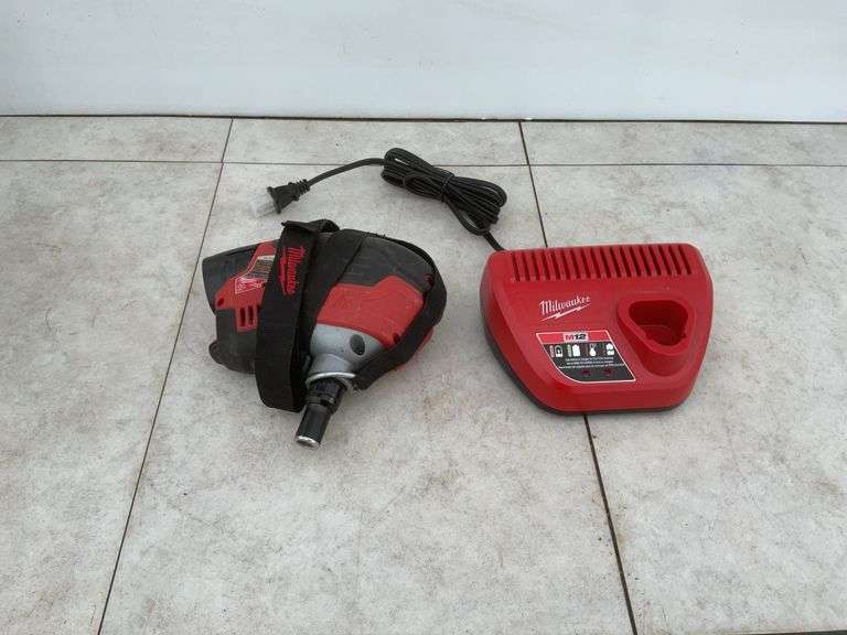 Like new Milwaukee M12 cordless Palm nailer comes with one battery and charger