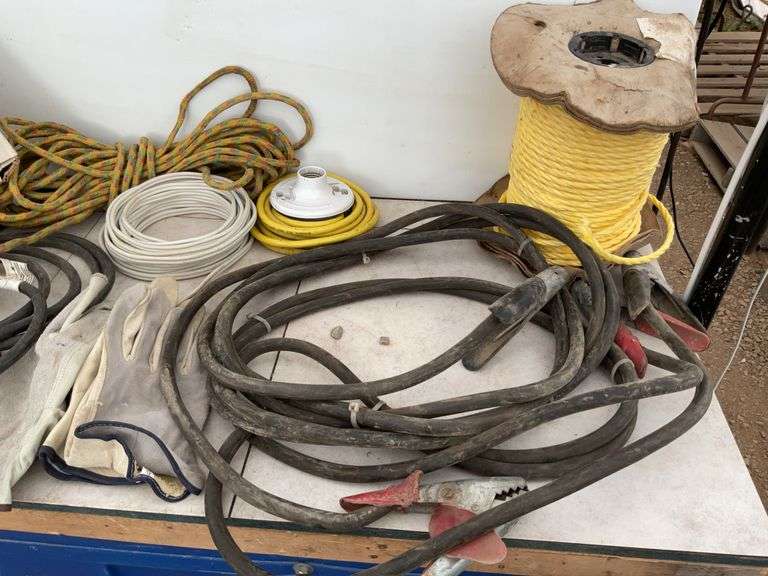 Pair of 14 foot heavy duty booster cables, quantity of new rope, miscellaneous ratchet straps, elect