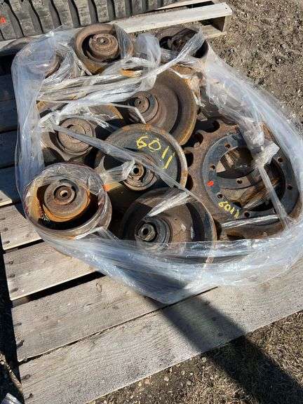 Pallet of Case 270 skidsteer bogey wheels & idlers - drive sprockets reversed once