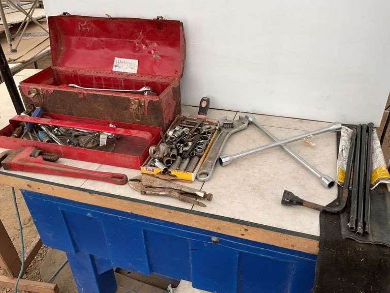 Toolbox comes with a quantity of miscellaneous tools including pipe wrench, crescent wrench, wheel w