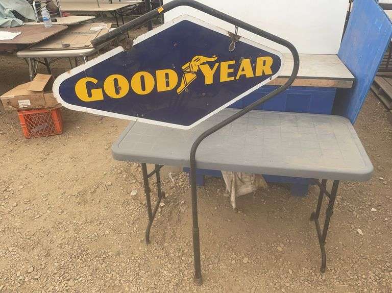 Double sided Goodyear sign, sign overall measures 40" x 20”, comes with a hanger stand
