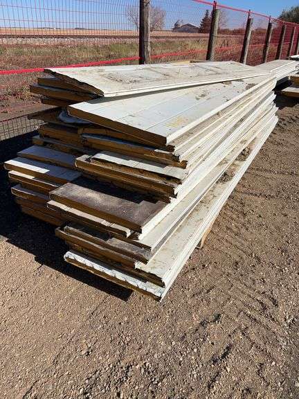 Large Qty of garage door panels various sizes & lengths (2 stacks)