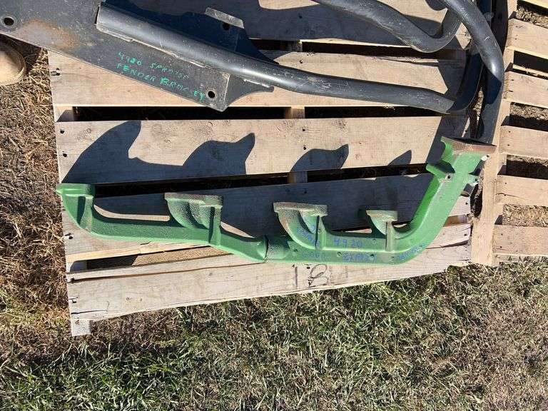 Roll of barbed wire, exhaust manifold for JD 4920 and fender brackets for same unit