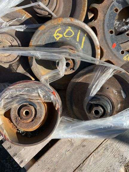 Pallet of Case 270 skidsteer bogey wheels & idlers - drive sprockets reversed once