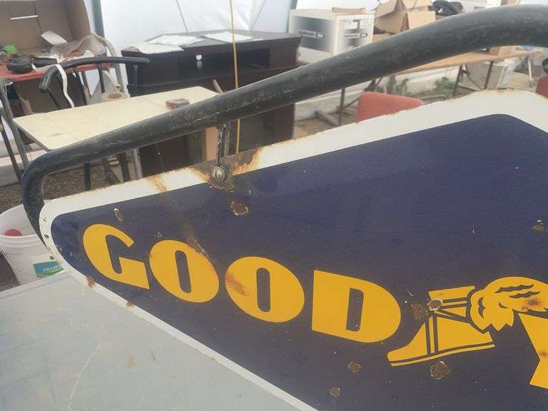 Double sided Goodyear sign, sign overall measures 40" x 20”, comes with a hanger stand