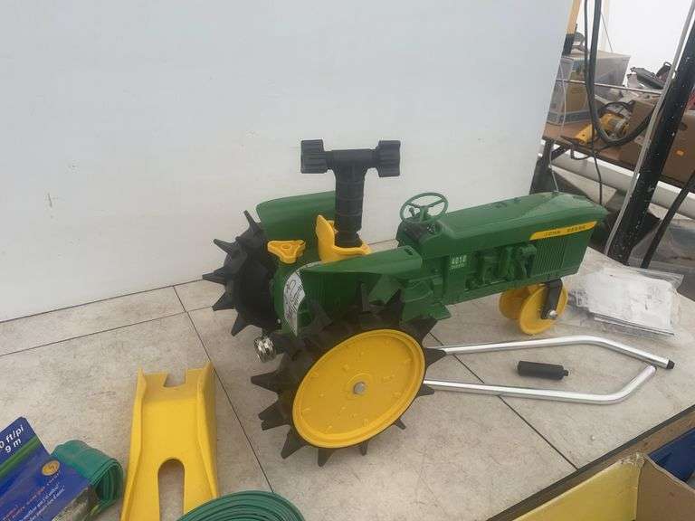 John Deere travelling sprinkler unused, pair of soaker hoses