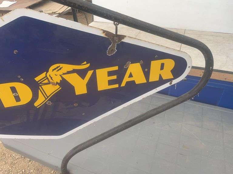 Double sided Goodyear sign, sign overall measures 40" x 20”, comes with a hanger stand