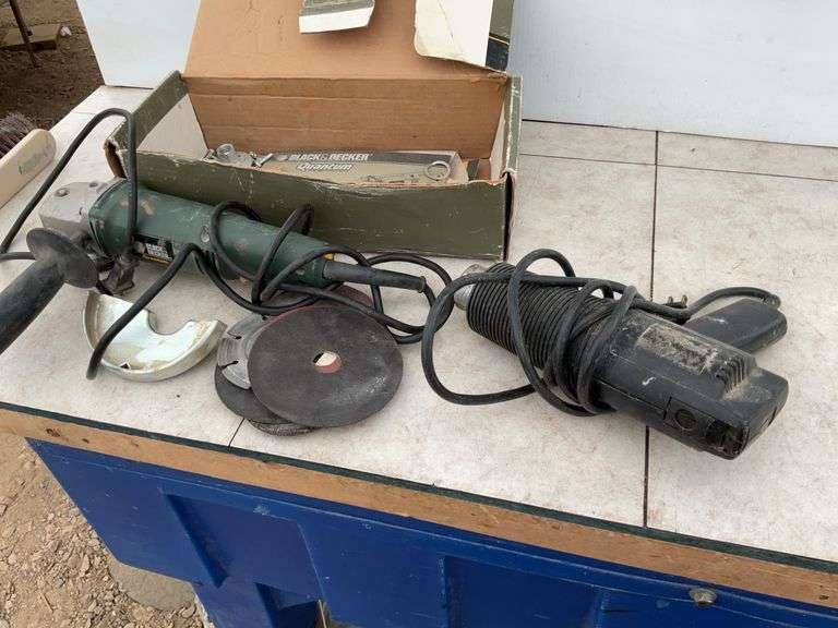 Working 4” Black Decker angle grinder, working heat gun