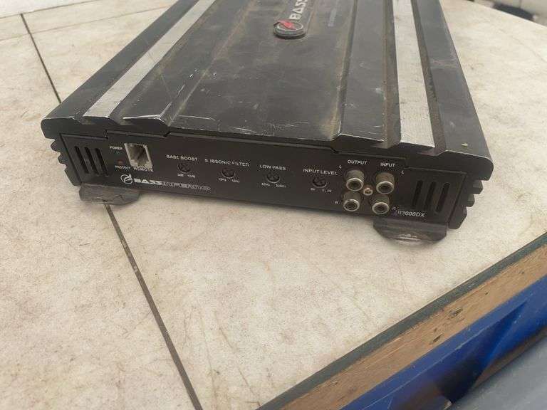 30 pound weight, a base amplifier - condition unknown, and a small set of screwdrivers