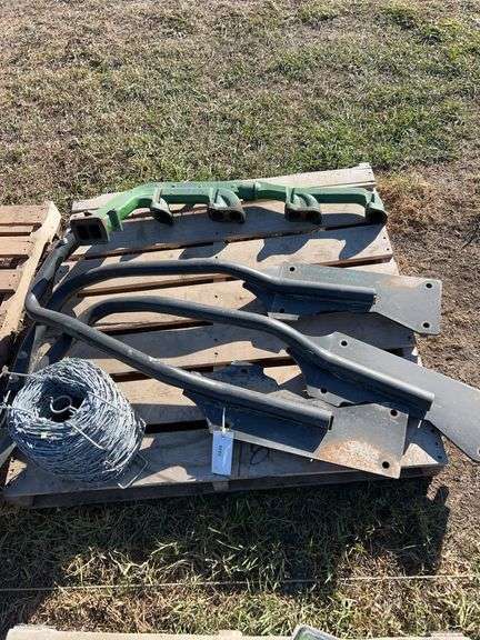 Roll of barbed wire, exhaust manifold for JD 4920 and fender brackets for same unit