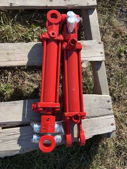 Pair of UNUSED hydraulic cylinders 16” centre pin to centre pin