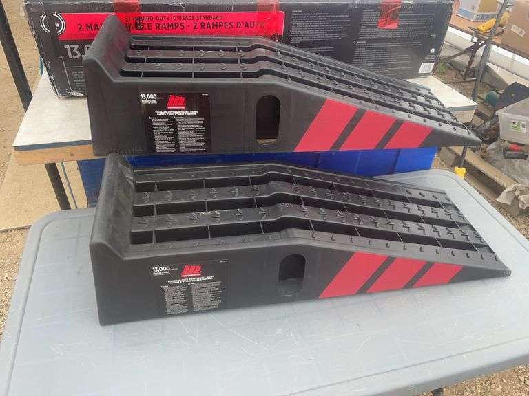 A pair of unused car ramps rated at 13,000 lbs