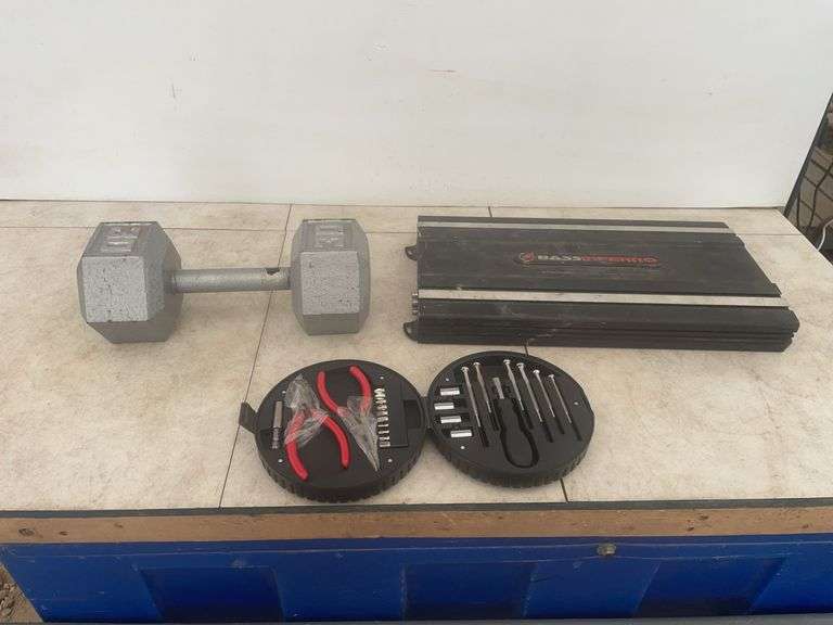 30 pound weight, a base amplifier - condition unknown, and a small set of screwdrivers