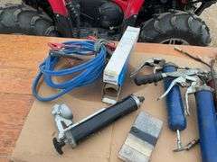 TOTE, several grease guns, grease, cork  gasket material, friction sway bar, booster cables, filter 