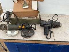 Working 4” Black Decker angle grinder, working heat gun