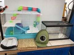 Hamster cage measures 23" long x 18" high x 13" wide, aquarium measures 20" long x 11" wide x 12" hi