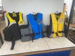 3 Fluid lifejackets one is large, one is extra large, and one is extra extra large