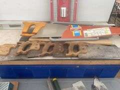 Post pounder, axe, quantity of hand saws, levels, hand mitre saw, trowels etc.