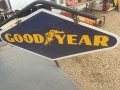 Double sided Goodyear sign, sign overall measures 40" x 20”, comes with a hanger stand