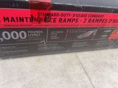 A pair of unused car ramps rated at 13,000 lbs