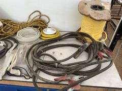 Pair of 14 foot heavy duty booster cables, quantity of new rope, miscellaneous ratchet straps, elect